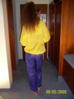 Woman Standing Facing Away from Camera (Blue Pants).jpg