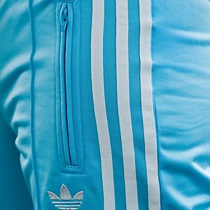 Adidas womans sky blue pants side shot zipper view