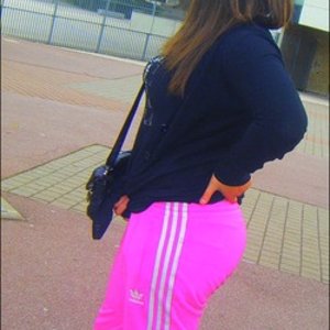 Adidas womans neon pink pants side view