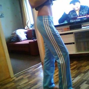 Adidas womans light blue pants barefoot other side shot