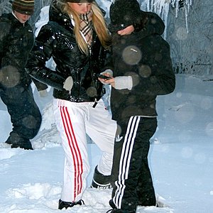 Adidas womans black pants with white stripes and white pants with red stripes