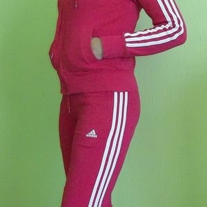 Adidas womans red track suit side pocket pose side
