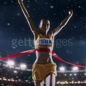 female-track-and-field-runner-crosses-finishing-line-video-id642234670.mp4