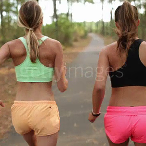two-female-athletes-running-in-the-forest-in-the-south-of-france-video-id493492882.mp4