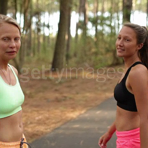 two-female-athletes-standing-in-the-forest-in-the-south-of-france-video-id493492822.mp4