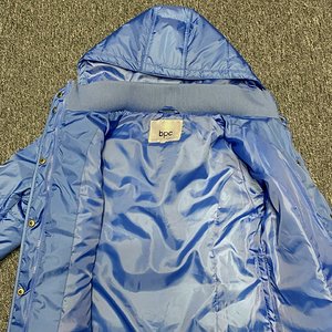 Light blue hooded nylon coat
