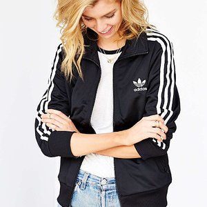 blonde in a black adidas firebird