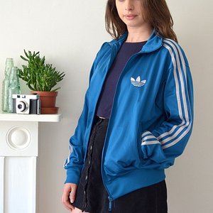brunette in blue adidas firebird