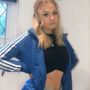 Blonde in blue adidas firebird jacket