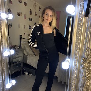 Blonde in black adidas firebird