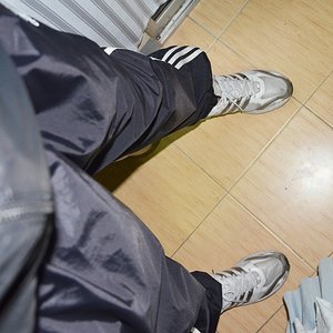 Black adidas shiny pants and jacket.