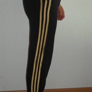 Adidas womans black pants no sleeve black top barefoot side