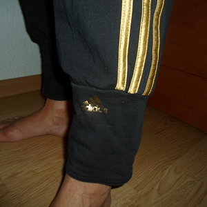 Adidas womans black pants gold trim shin logos