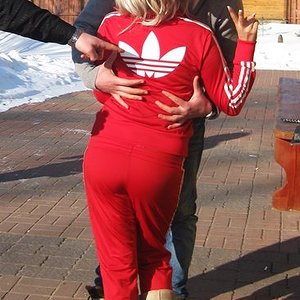 Adidas womans red track suit with white trim large back logo hug