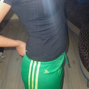 Adidas womans green pants with white stripes black no sleeve top side
