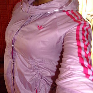 Adidas womans shiny light pink top with dark pink trim semi front
