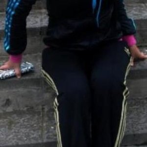 Adidas womans black pants with gold stripes black top with light blue stripes