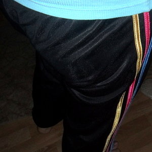 Adidas womans black pants red white and yellow stripes rear