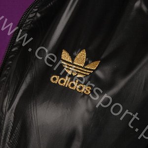 Adidas womans shiny black jacket gold trim side logo front close shot