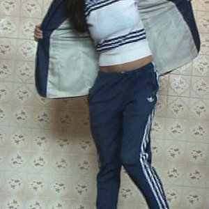 Adidas womens track suit open jacket pose