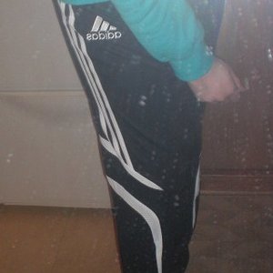 Adidas womens black pants with white stripe side logo shot