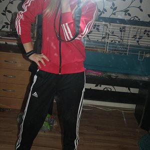 Adidas womens black pants with white stripes sporty red Adidas jacket