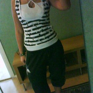 Adidas womens black baggy pants with black and white top front shot