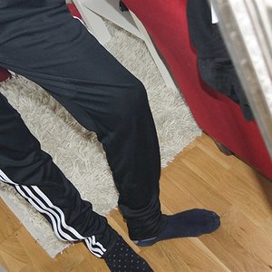 Adidas womens black pants tilted angle down shot