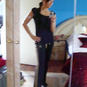 Adidas womens black pants white stripe hip pose camera