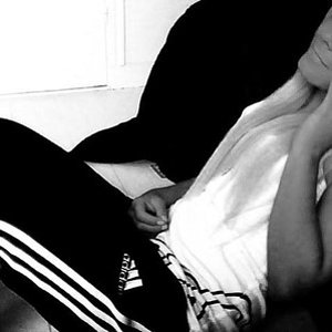 Adidas womens black pants sitting black and white angle