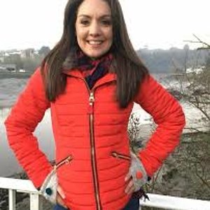 Laura Tobin red down jacket