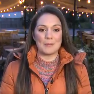 Laura Tobin orange down jacket