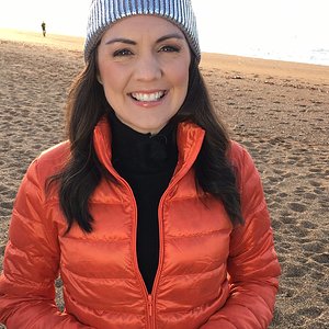 Laura Tobin orange down jacket