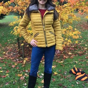 Laura Tobin yellow down jacket