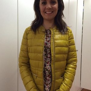 Laura Tobin yellow down jacket