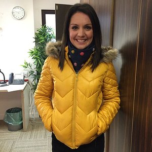 Laura Tobin yellow down jacket