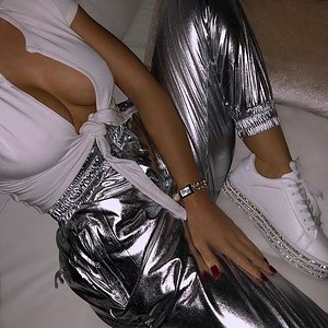 Hot girl in shiny silver pants