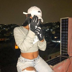 Nasty girl putting her sporty gloves