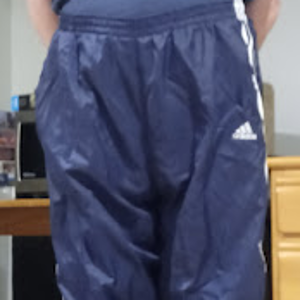 Me in my Dark Blue Adidas Nylon Pants with my hands behind my back 2