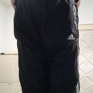 Me wearing my Small Black Adidas Nylon Pants with my hands behind my back 1