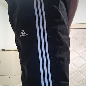 Me wearing my Small Black Adidas Nylon Pants with my hands behind my back 3