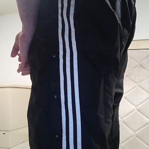 Me wearing my Small Black Adidas Nylon Pants with my hands behind my back 4