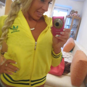 Adidas womens yellow jacket front view camera