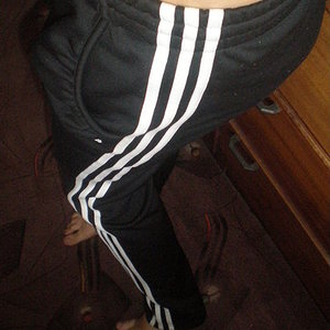 Adidas womens black pants white stripe dance pose