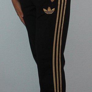Adidas womens black pants gold trim side view