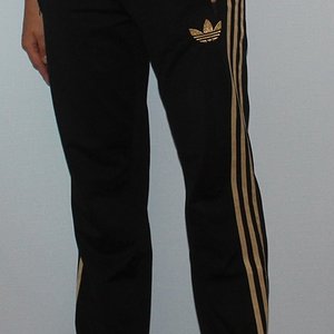 Adidas womens black pants gold trim front view