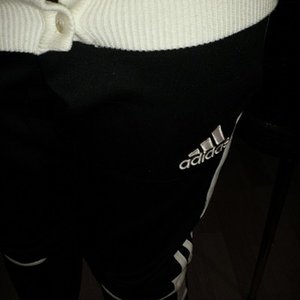 Adidas black womens pants small logo close shot