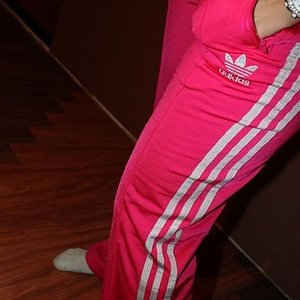 Adidas womens light red pants high angle side shot