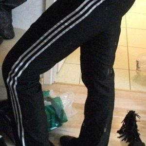 Adidas womens black pants hight knee pose