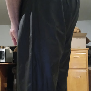 Me in my Medium Black Helly Hansen Polyester Pants w/my hands behind my back (side 2, close-up)